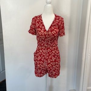 Beautiful and fun floral red romper with pockets, front or back tie